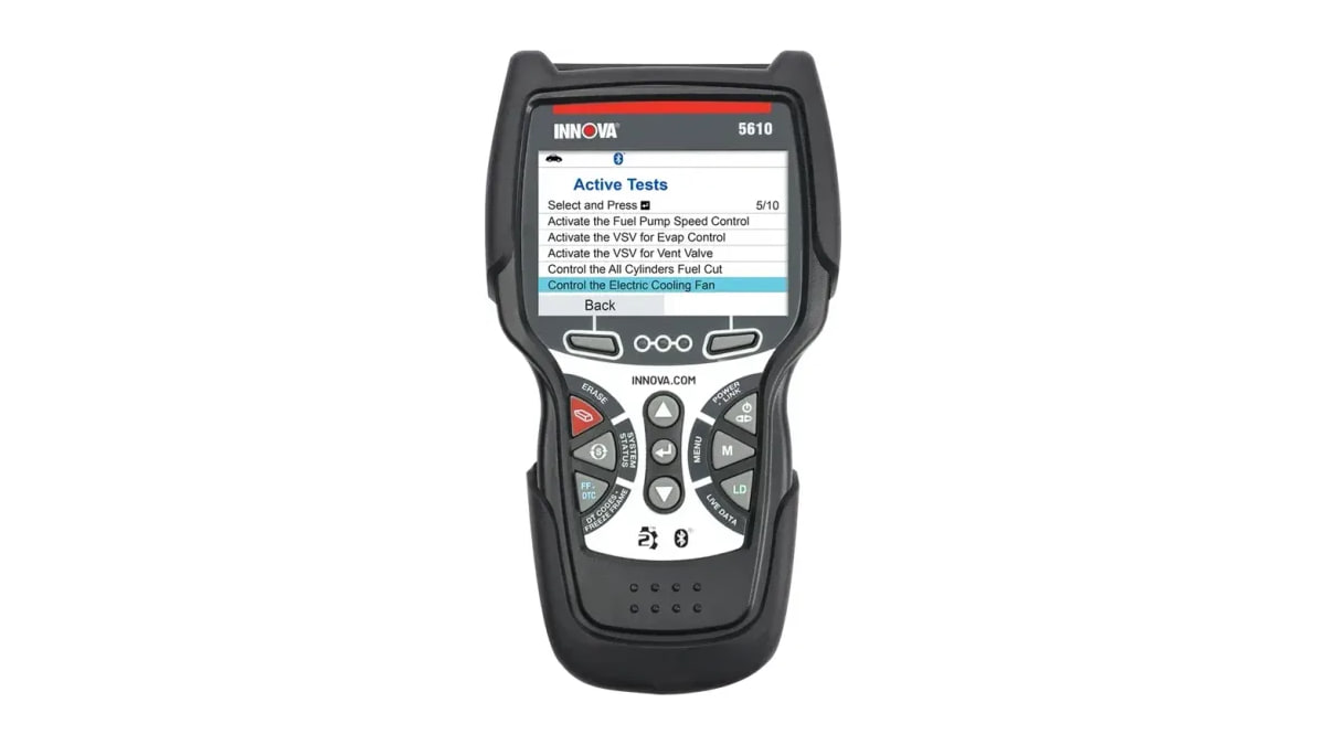 Black Innova 5610 scanner viewed from the front with its screen displaying an active tests menu.