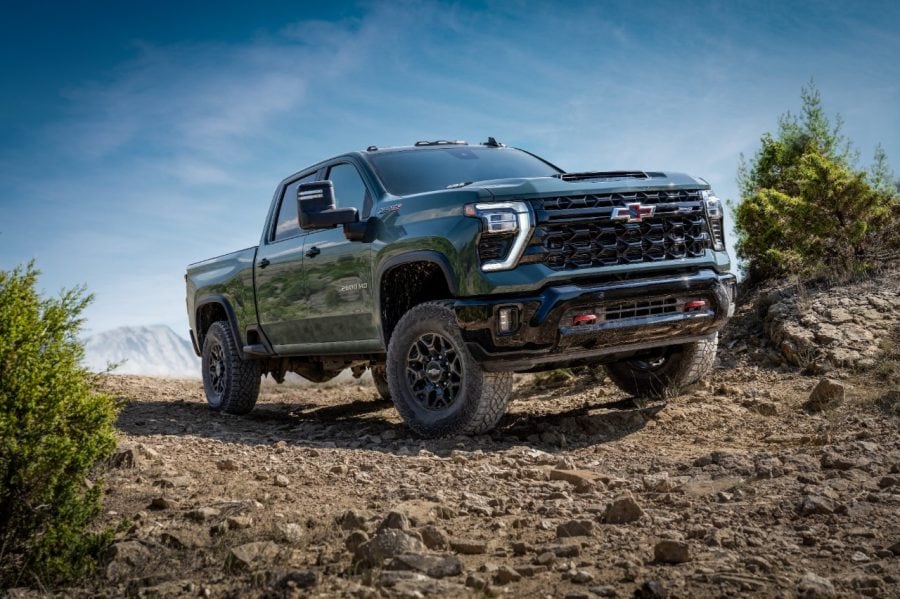 A Chevrolet Silverado HD ZR2 on rocky terrain, viewed from the front and driver's side.
