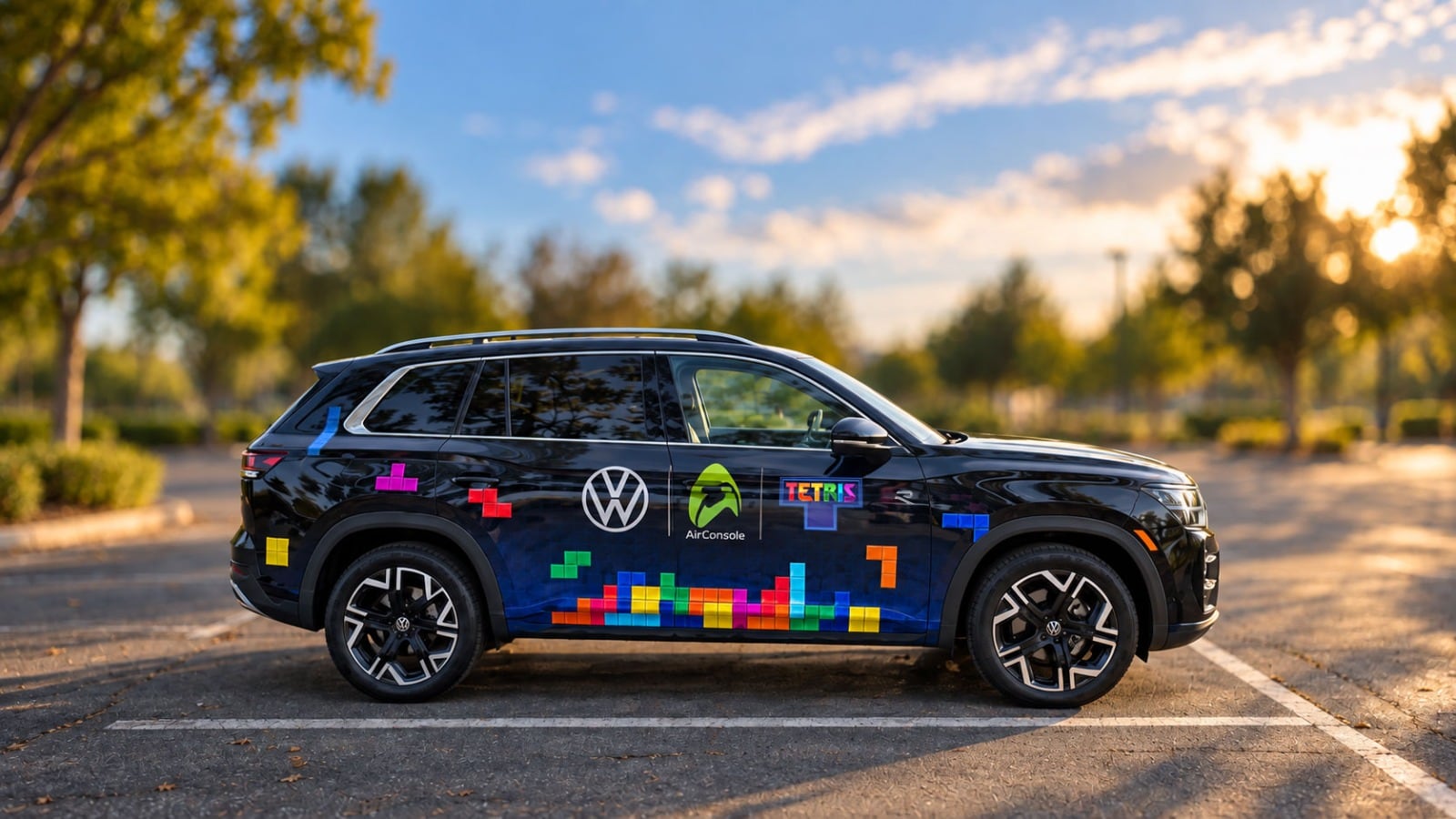 A black Volkswagen SUV with colorful Tetris blocks and AirConsole branding parked outdoors.